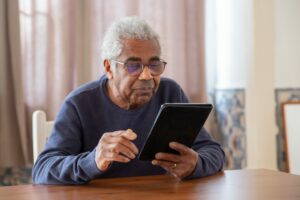 Elderly man on tablet